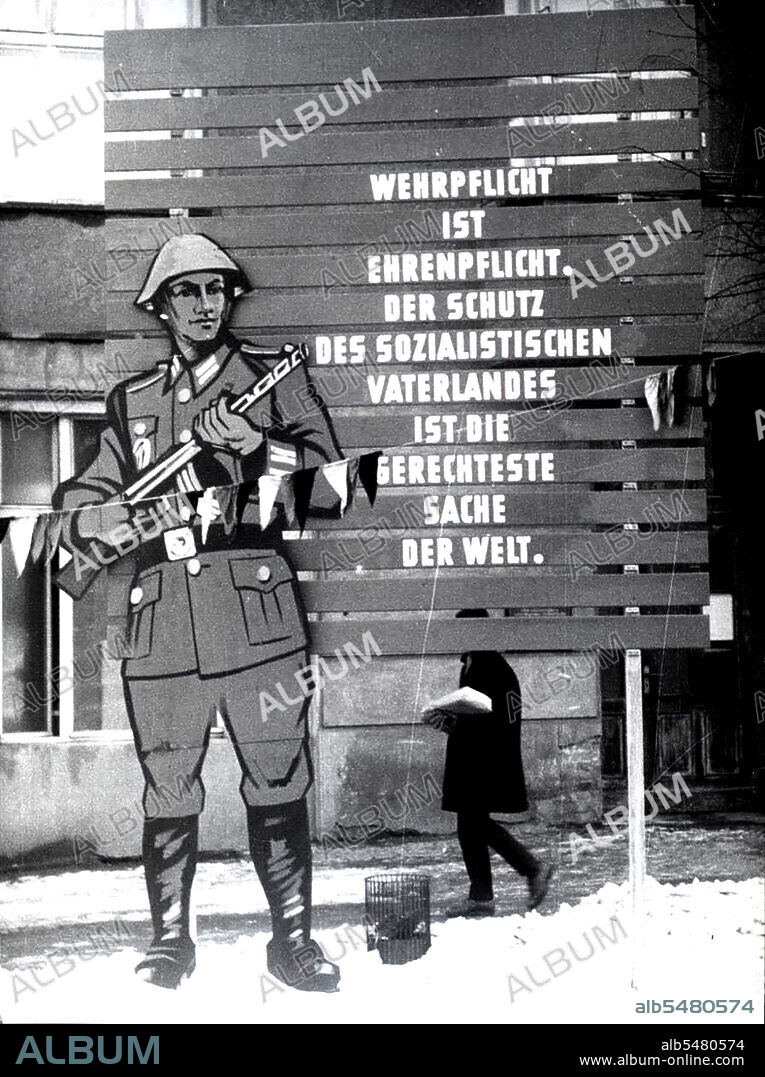 Berlin Wall Photo - March 1962 - 'National Military Service is an Obligation of Honor to Our Socialist Fatherland and is the Most Righteous Thing in the World'. Propaganda Poster in East Berlin Advertising the 'Righteous Thing in the World'.