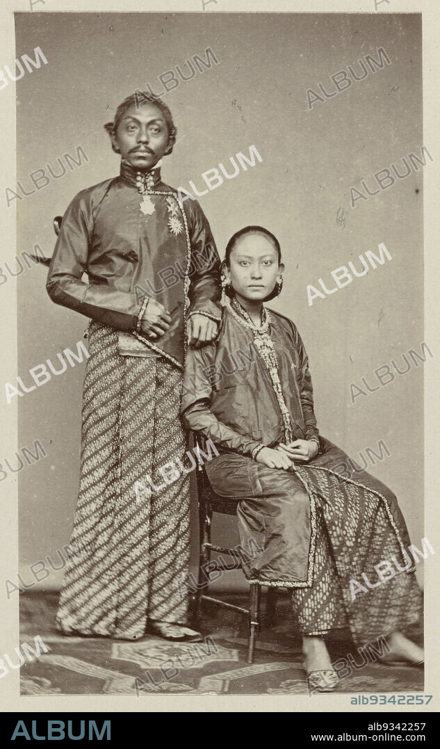 Pakoe Boewono IX, Susuhunan of Surakarta with his wife Ratoe, Studio portrait of Pakoe Boewono IX, Susuhunan of Surakarta, with his wife Ratoe. Pasted-in photo in the photo album titled: Faces of Java., Woodbury & Page, Batavia, 1868 - 1872, photographic support, albumen print, height 95 mm × width 56 mm.