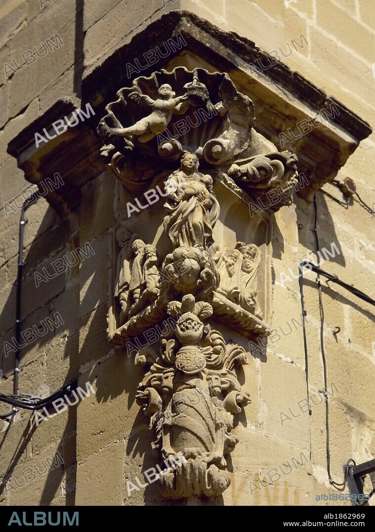 Spain. La Rioja. Cuzcurrita del Rio Tiron. Sculptural detail, religious theme, on the cornerstone of a building.
