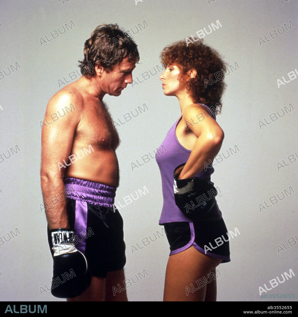RYAN O'NEAL and BARBARA STREISAND. BARBRA STREISAND and RYAN O'NEAL in THE MAIN EVENT, 1979, directed by HOWARD ZIEFF. Copyright WARNER BROTHERS.