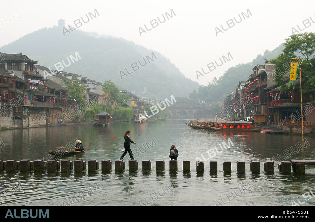 Fenghuang is Chinese for Phoenix and refers to the mythical sacred firebird that can be found in the mythologies of the Persians, Greeks, Romans, Egyptians, Chinese, and (according to Sanchuniathon) the Phoenicians. Legend suggests that two phoenixes on discovering the town hovered overhead for some considerable time before reluctantly flying away. Fenghuang town is a well-preserved ancient town supposedly dating back to 248 BC. It is home to the Miao and Tujia minorities. The distinctive architecture includes Ming and Qing styles.