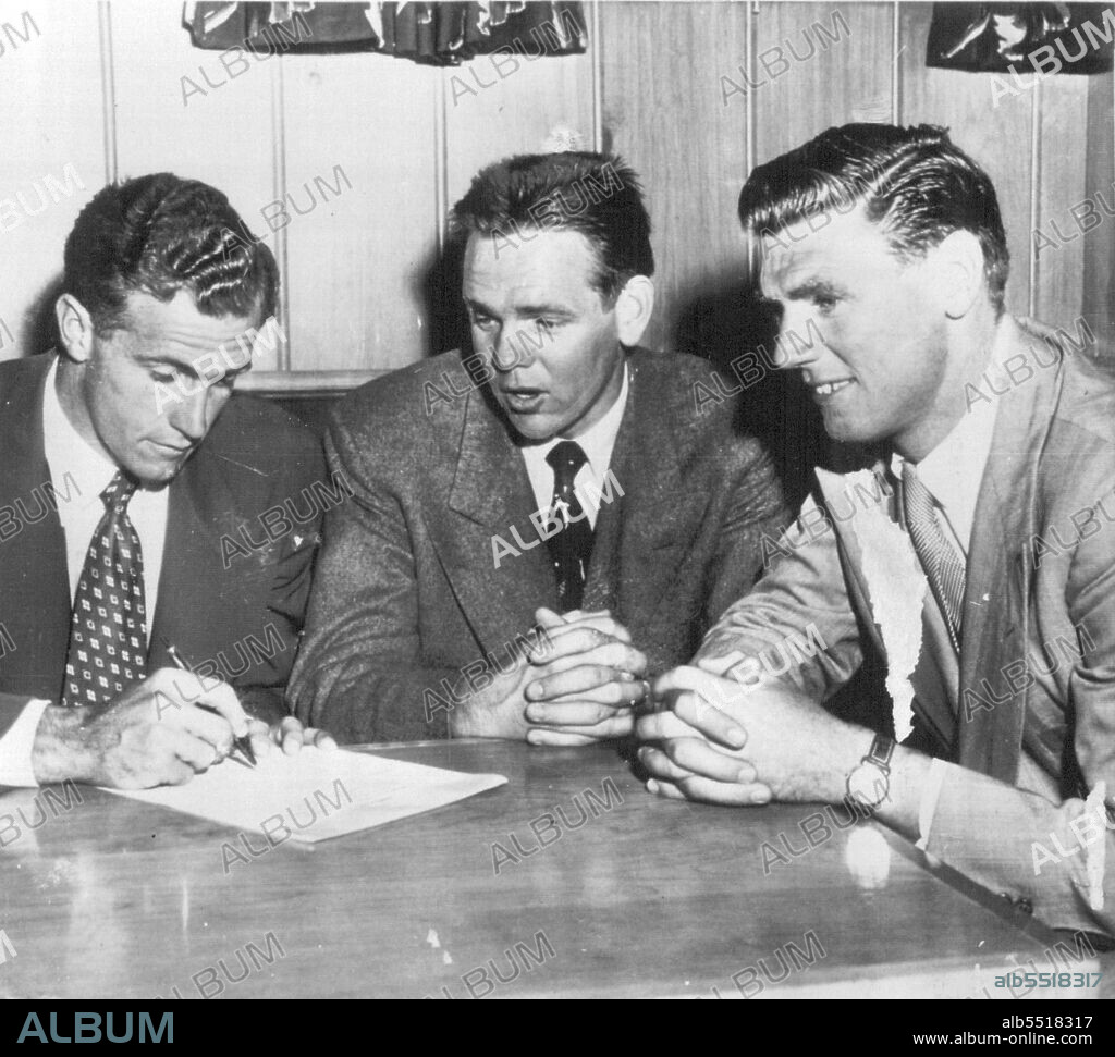 Aussie Tennis Aces Sign Contract - Ken McGregor (left) and Frank Sedgman (right), Stars of the Australian Davis Cup team, sign $100,000 professional Tennis contract after their arrival here today, in the center is Jack Kramer, American Ace, who will play Segman while McGregor will play against Pancho Segura. January 04, 1953. (Photo by AP Wirephoto).