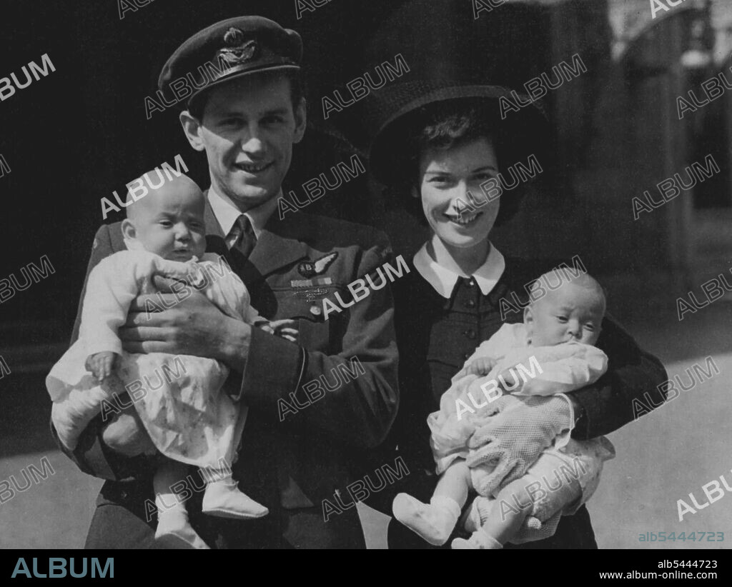 The Twins go to Buckingham Palace -- Flying-officer J. Moller, with his wife and twin sons, five-months-old John and Anthony, leaving Buckingham Palace after a recent investiture, when F/O. Moller received the Distinguished Flying Medal. Bas May 2nd. F/O. John A. Moller is from Taranaki, New Zealand. January 01, 1944.