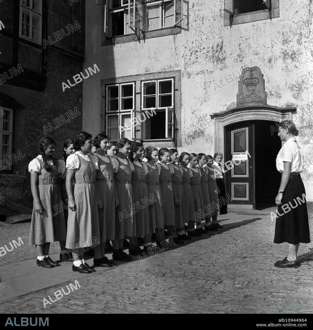 The head of the BdM camp at Polle delivering a speech to the BdM girls at Polle, Germany 1930s.