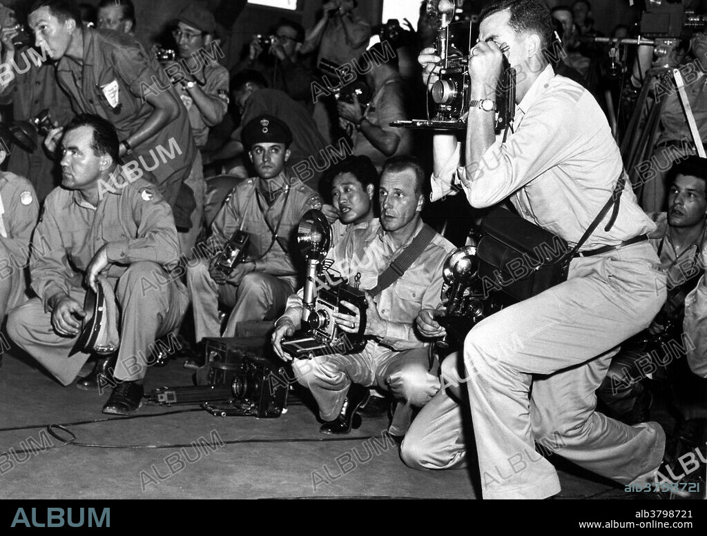 Caption: "U.N. correspondents at the armistice building, Panmunjom, Korea. July 2.3, 1953" The Korean Armistice Agreement is the armistice which ended the Korean War. The armistice was designed to "insure a complete cessation of hostilities and of all acts of armed force in Korea until a final peaceful settlement is achieved." No "final peaceful settlement" has been achieved yet. The signed armistice established the Korean Demilitarized Zone, put into force a cease-fire, and finalized repatriation of prisoners of war. The Demilitarized Zone runs not far from the 38th parallel which separated Northern and Southern Koreas before the war. Photograph credited to Weber, USN.".