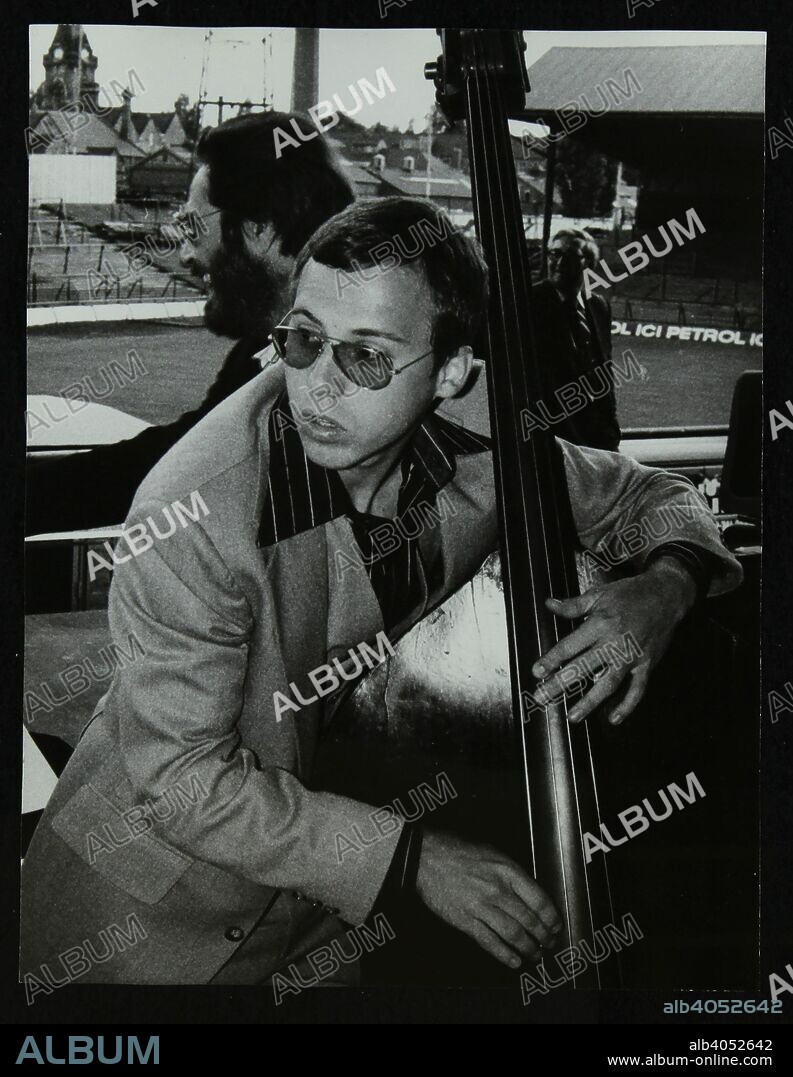 Bassist Marc Johnson and pianist Bill Evans at the Newport Jazz Festival, Ayresome Park, Middlesbrough, 1978. Dennis Matthews, publisher of jazz magazine Crescendo, is in the background.
