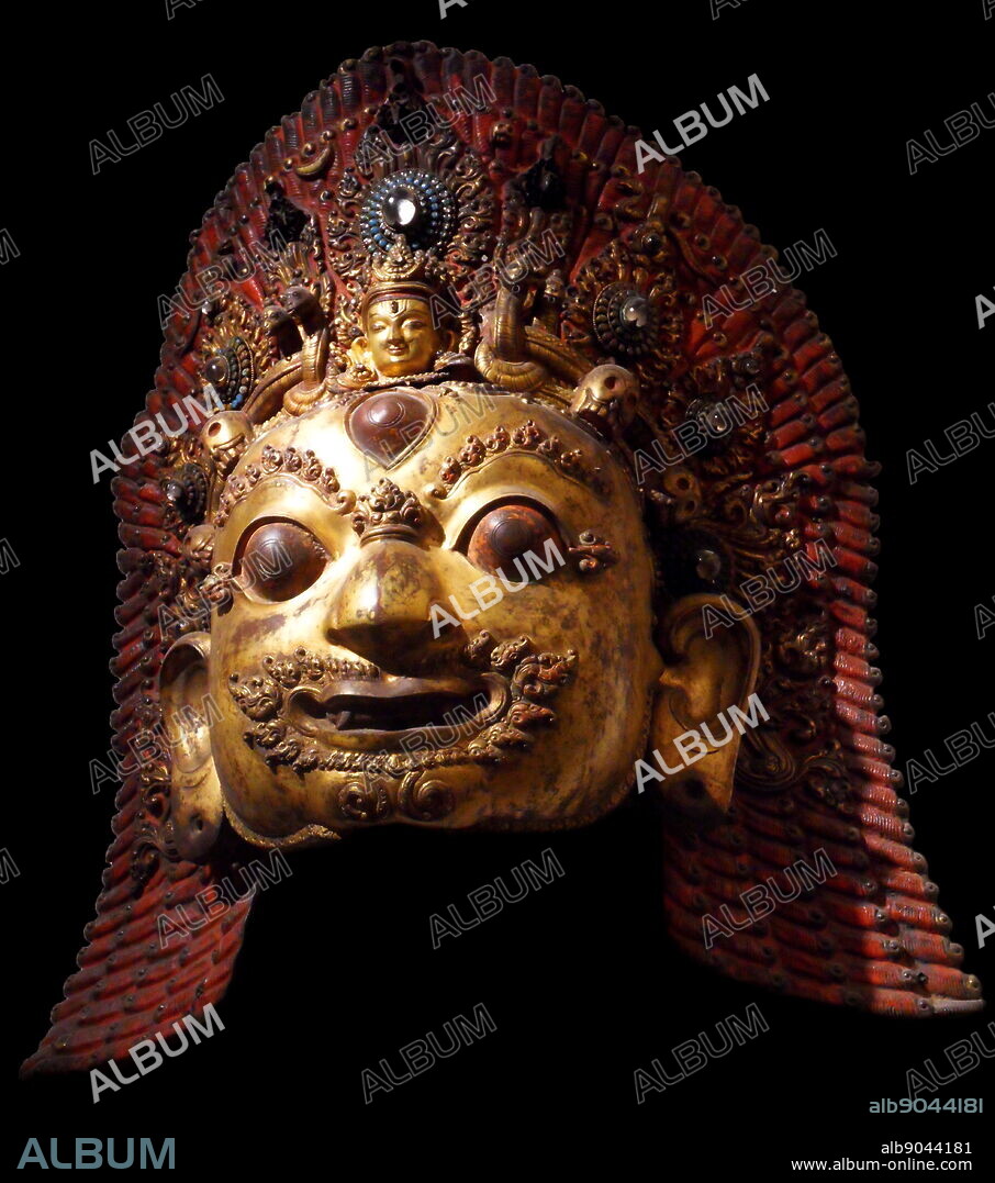 Mask of Bhairava. A destructive manifestation of Shiva. This Hindu deity was adopted by Tantric Buddhism of Tibet known as Vajrabhairava. 16th-17th century sculpture, copper encrusted, gilded and hammered.