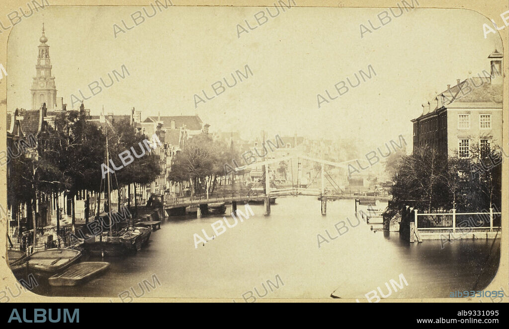 View of the Zwanenburgwal in Amsterdam, View from the house Amstel 126 on the Zwanenburgwal with the Diaconie orphanage, Amstel 1, on the right and the tower of the Zuiderkerk on the far left in the background. The photo was taken from the home of the painter Johann Georg Schwartze, who was based at this address until May 1856., Eduard Isaac Asser, Amsterdam, c. 1853, paper, salted paper print, height 115 mm × width 196 mm.