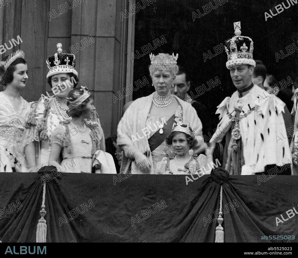 King George VI, wearing the Imperial State Crown, on the balcony of Buckingham Palace after the Coronation where he acknowledged the cheers from the vast crowds that had gathered to acclaim the newly-crowned Sovereign. With him are Queen Elizabeth, Queen Mary, Princess Elizabeth and Princess Margaret. The Princesses are wearing their coronets which they put on with the Peeresses, after the crowning of the Queen. June 3, 1953.