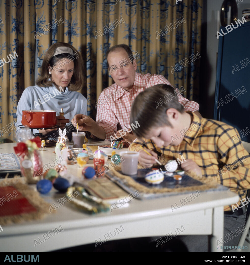 Homestory of the German television and film director as well as actor Jürgen Roland preparing for Easter here his wife Eva and his children, Germany Hamburg circa 1977.