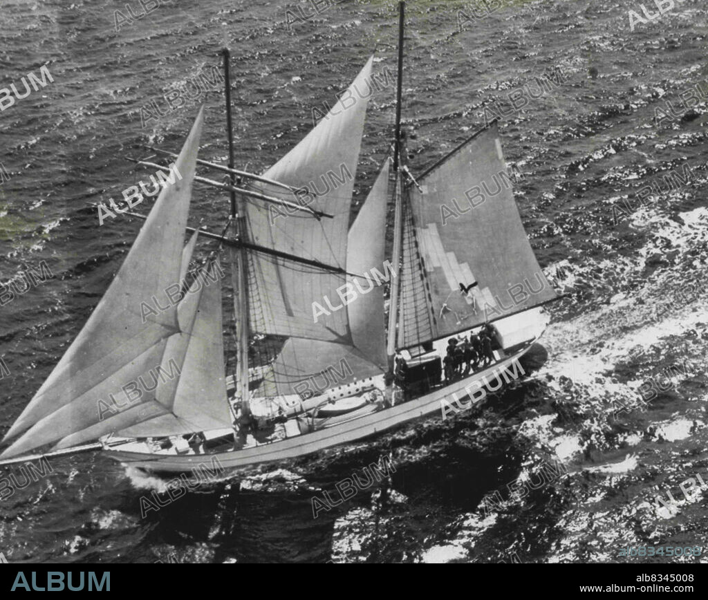 Nears Completion of Round The World Cruise -- The brigantine Yankee, famed vessel skippered by Capt. Irving Johnson, is shown ten miles off here yesterday enroute to her home port of Gloucester, Mass., and the end of an 18-month round the world cruise with a "gentleman crew" of 18. The vessel due in Gloucester Sunday afternoon. April 25, 1952. (Photo by AP Wirephoto).