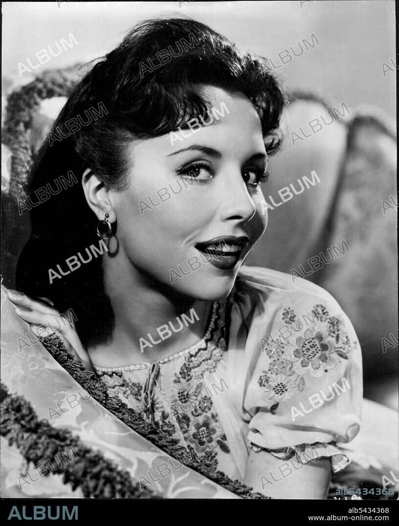A gay, reckless laugh from German star Sonja Ziemann, Opening in her first British film, Made in Heaven, at the Lyceum today. Sonja's jet black hair and deep blue eyes, combined with her other attributes, earned her the name Able-Bodied Ziemann on the set. November 29, 1954. (Photo by J. Arthur Rank Organization Ltd.).