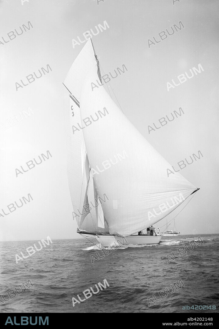 The 19-metre class 'Corona' running downwind, 1911. 'Corona', one of only six 19-metre class yachts ever built, was designed by William Fife III and launched in 1911.