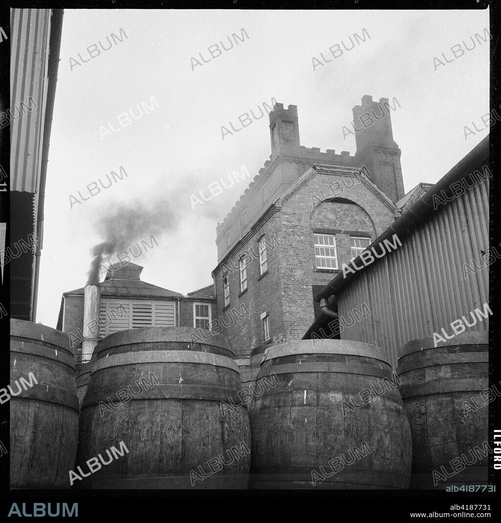 Tower Brewery, Wetherby Road, Tadcaster, North Yorkshire, 1966-1974 The Tower Brewery, premises of the Tadcaster Brewery Company on Wetherby Road, viewed from the south west with barrels in the brewery yard in the foreground.