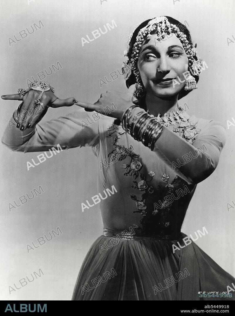 Ancient Temple Dance - Mari Jinishian, Syrian danseuse and former member of the La Meri oriental ballet troupe, introduces a scared East Indian temple dance, "The Revering of Krishna," in Columbia's Technicolor spectacle, "A Thousand and One Nights." The ancient Hindu ritual, and story is told completely with the dancer's hands. Established originally centuries age, the routine is handed down from daughter to daughter in the temples of the Far East, and it is now performed precisely as it was created in the long ago. Decreed there be two types of Love, Sacred and Profane." October 06, 1950.