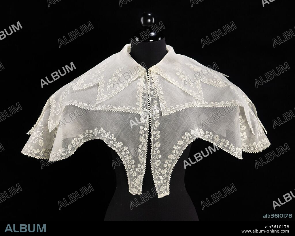 Pelerine. Culture: American. Date: ca. 1835.
This is a quintessential example of the multi-tiered pelerine collars of the 1830s that lay on top of  the large gigot dress sleeves. The combination of floral embroidery, saw-tooth borders and various pointed edges creates a visually compelling effect.