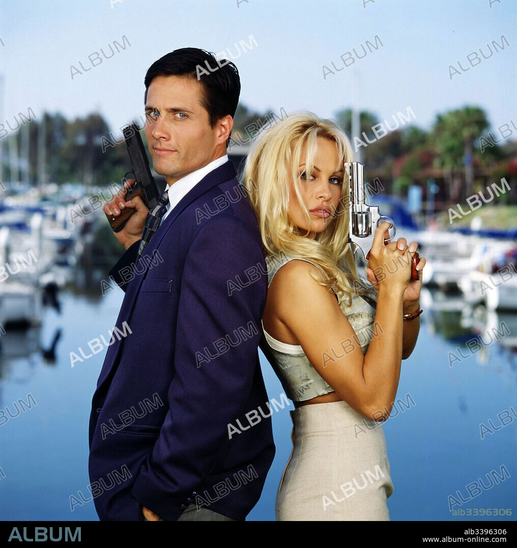 PAMELA ANDERSON and ROB ESTES in COME DIE WITH ME: A MICKEY SPILLANE'S MIKE HAMMER MYSTERY, 1994, directed by ARMAND MASTROIANNI. Copyright CBS ENTERTAINMENT PRODUCTION.