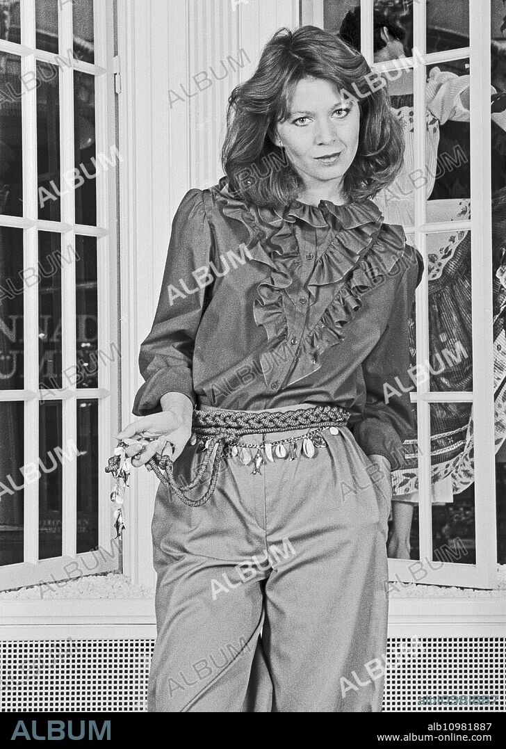 German actress and TV host Gabi Kimpfel presenting the latest in fashion, Germany around 1984.