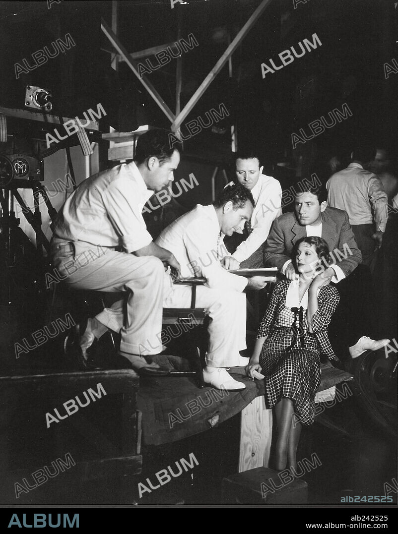 FRANK BORZAGE, JOSEPH AUGUST, LEW BORZAGE, LORETTA YOUNG and SPENCER TRACY in A MAN'S CASTLE, 1933, directed by FRANK BORZAGE. Copyright COLUMBIA PICTURES.