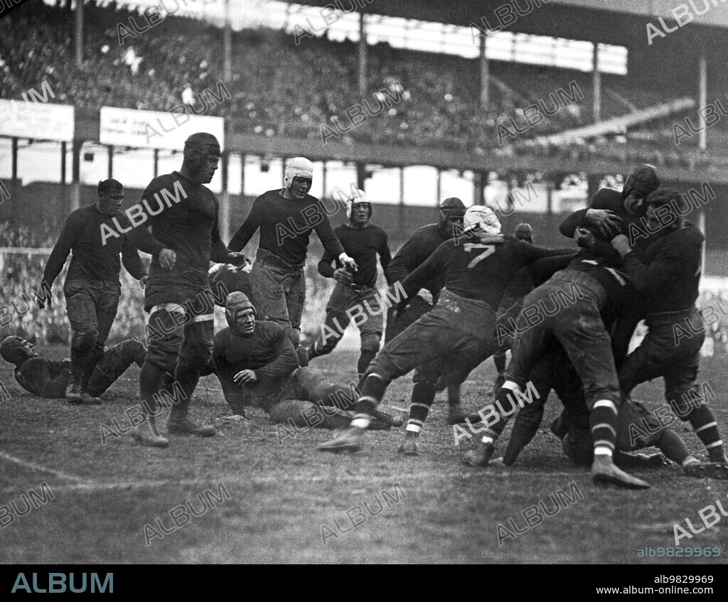 New York, New York November 11, 1925, The Giants, New York's professional football team, beat the Kansas City Cowboys by a score of 9-3 this afternoon at the Polo Grounds, Cowboys fullback circa Hill, formerly of Baylor University, shown being tackled.