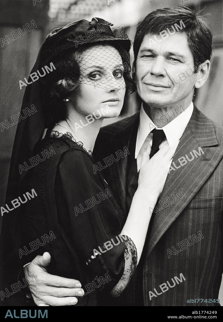 Charles Bronson embracing Jill Ireland on the set. American actor Charles Bronson embracing English actress Jill Ireland, his wife, on the set of the film 'The Valachi papers'. Rome, 1970s.