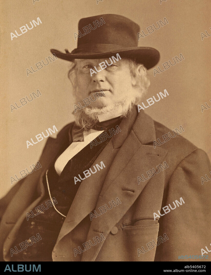 Horace Greeley (1811-1872) was an American newspaper editor, a founder of the Liberal Republican Party, a reformer, a politician, and an outspoken opponent of slavery. The New York Tribune (which he founded and edited) was America's most influential newspaper from the 1840's to the 1870's and established Greeley's reputation as one of the greatest editors of his day. He was noted for his eccentricities. His attire in even the hottest weather included a full-length coat, and he was never without an umbrella. Photographed by Napoleon Sarony in 1869.