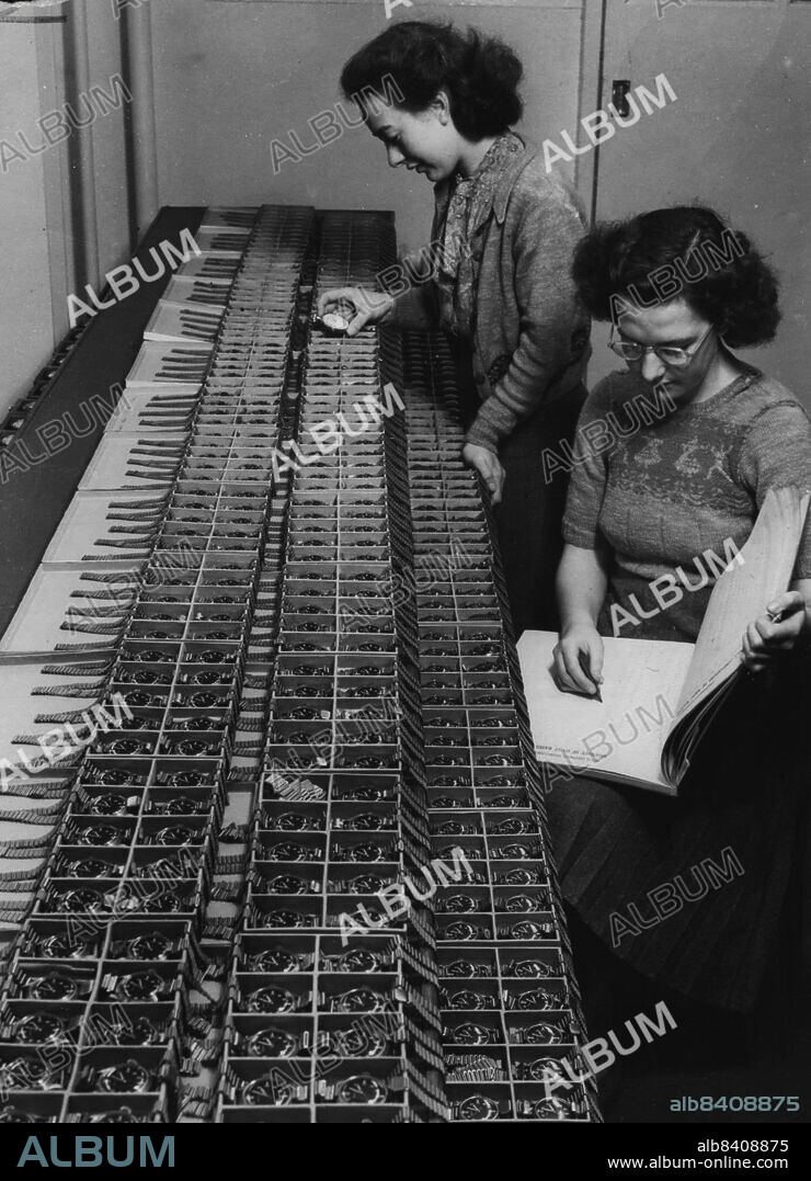 New High-Standard Watch Will Aid Modern Day Flyers.In the Chronometer Department of the Royal Greenwich Obervatory at Hurstmonocrux Castle, two female workers, Miss Margaret Newman (nearest camera), of Eastbourne, and Miss Cynthia Ryall; of Seend (Wiltshire) make & daily check on a batch of the new-type wrist watches for the uses of air navigators. January 8, 1950.