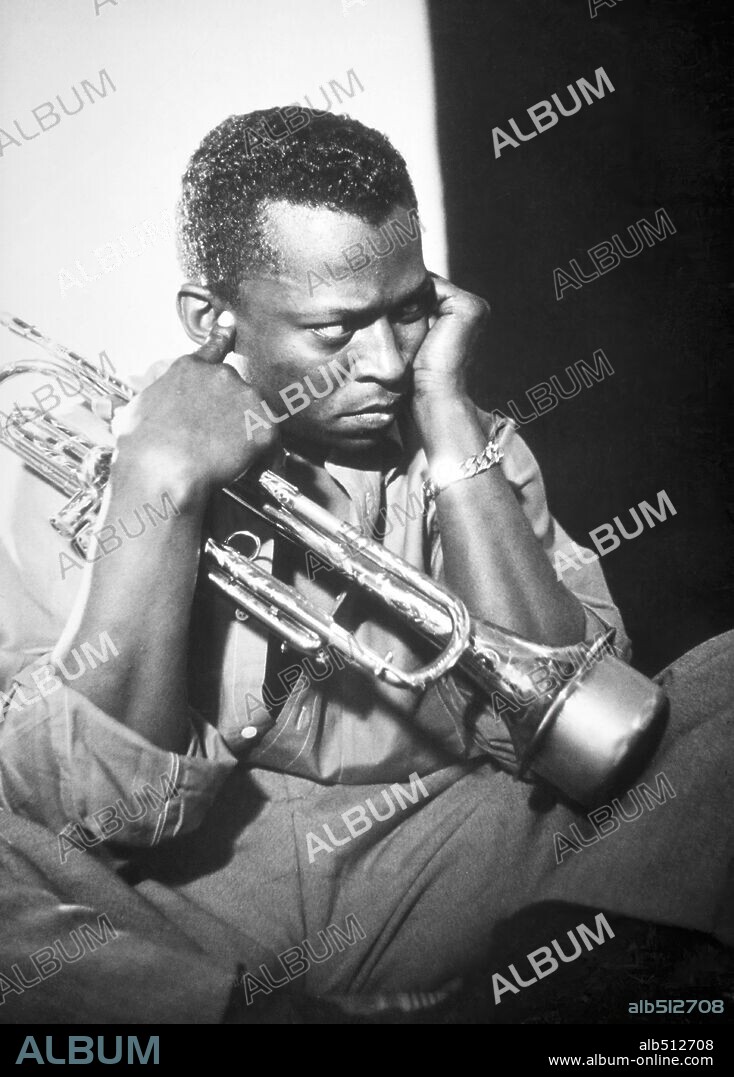 Jazz trumpeter Miles Davis poses for a portrait early in his career playing his horn in circa 1955 in New York City.