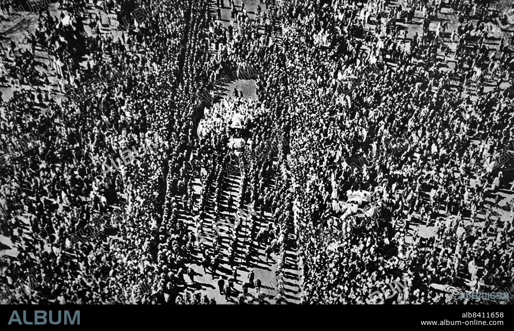 The body of Mahatma Gandhi is drawn by Indian naval ratings on the way to the pyre on the banks of the Jumna for his funeral in 1948. Mohandas Karamchand Gandhi (2 October 1869 - 30 January 1948) was an Indian lawyer, anti-colonial nationalist and political ethicist who employed nonviolent resistance to lead the successful campaign for India's independence from British rule, and to later inspire movements for civil rights and freedom across the world.