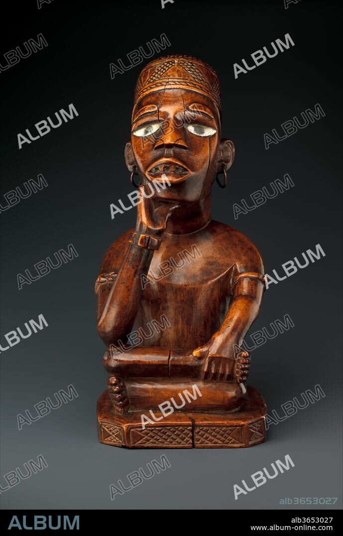 Seated Male Figure. Culture: Kongo peoples, Kakongo group. Dimensions: H. 11 1/2 in. (29.2 cm). Date: mid to late 19th century.
In Kongo culture, figurative sculptures delineate and concretize the threshold between the worlds of the living and the dead. Displayed in shrines, a series of wood sculptures depicting a male figure flanked by a courtly entourage of wives, attendants, and retainers served to honor and commemorate the memory of important individuals. Such representations are part of a complex of art forms which afforded access to influential ancestors and which were also appreciated for their aesthetic excellence.
This idealized image of a leader once constituted the central protagonist of such a grouping. His meditative stance reflects simultaneously upon his destiny in the other world and his ongoing responsibilities to the living. The figure's chiefly identity is revealed through both the distinctive posture and the signs of rank that include a patterned hat, filed teeth, and decorative scarification patterns.
The Kongo artist responsible for this work captured a great deal of expression in the figure's contemplative facial features; the bold rendering of the torso and the positioning of the arms also convey a sense of dynamism in repose.