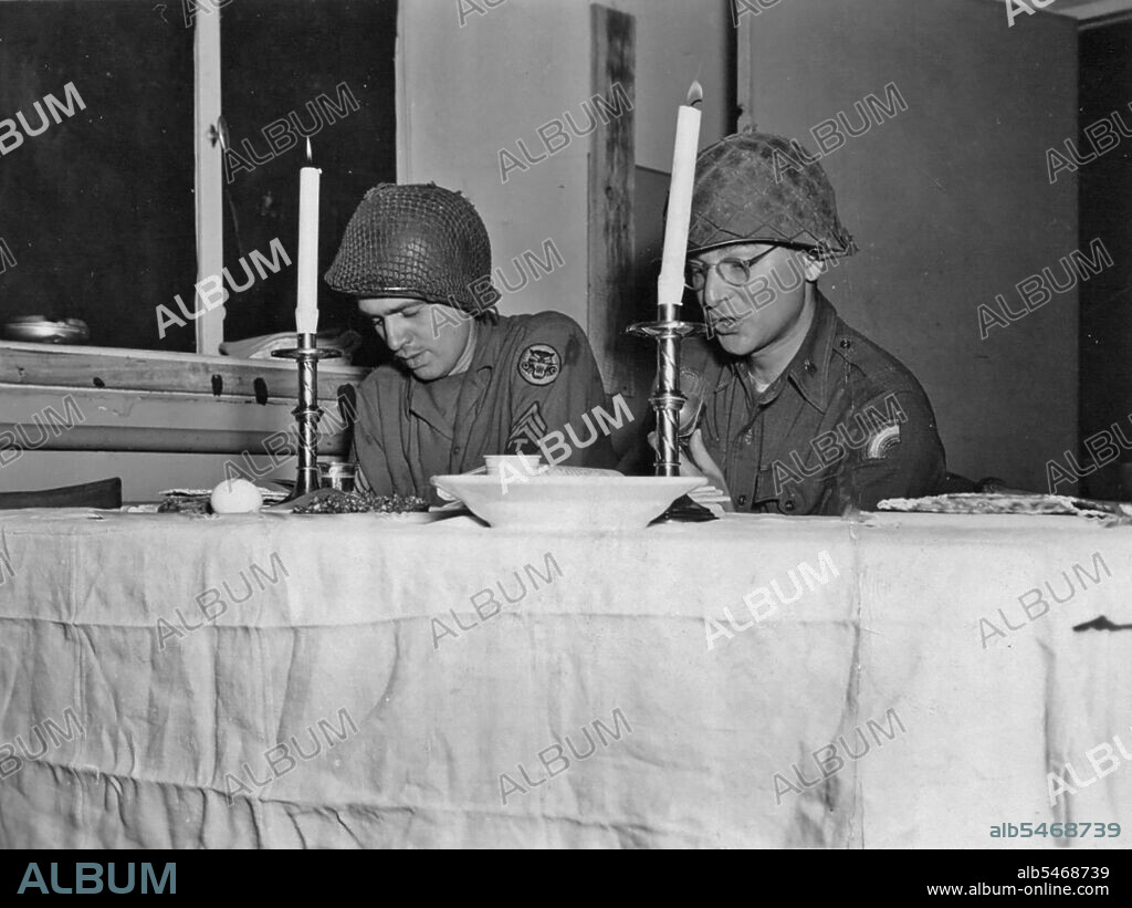 U.S. Army Chaplain (Maj.) Eli Bohnen, right, a rabbi serving with the 42nd Infantry Division in World War II, leads a seder service during the Jewish holiday of Passover in Dahn, Germany March 28, 1945.