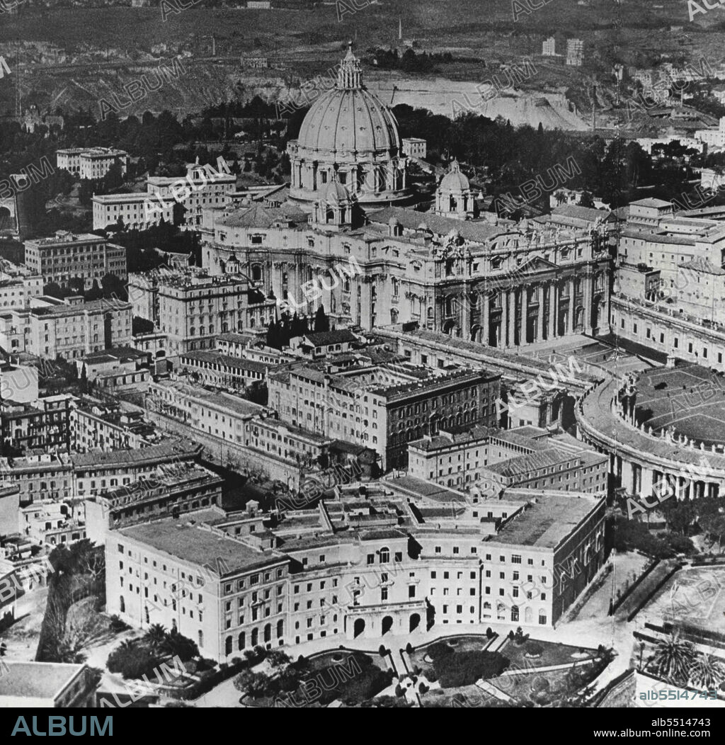 St. Peter's, Rome -- Aerial view of he famous Basilica in Rome, the Pope's own Cathedral. On far right is the Vatican Palace, which covers an area of 7 acres has been the Papal residence since the late 14th century. February 24, 1954. (Photo by Karl Gullers, Camera Press).