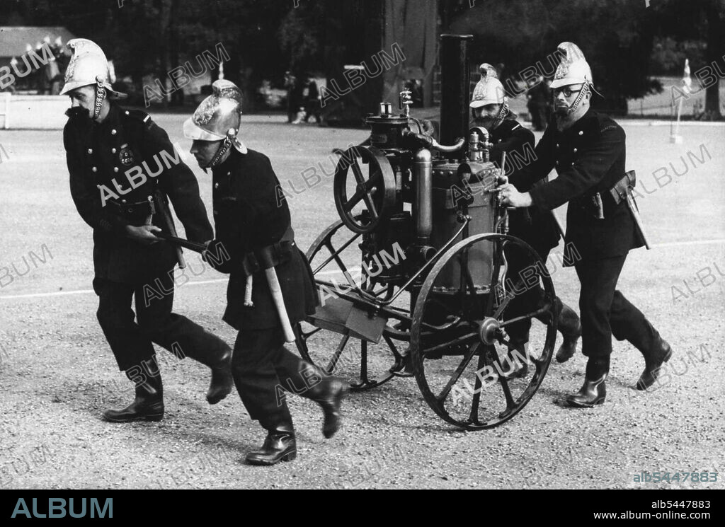 Fire-Fighters Of Old - Fire-fighting as it used to be an amusing picture during a Kent Fire Brigade display of ancient and modern fire-fighting held at Maidstone, Kent. An ancient steam-pump which had to be manhandled by the firemen to the scene of the outbreak. October 3, 1949. (Photo by Sport & General Press Agency Limited).