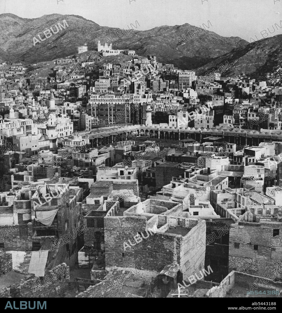 Mecca The Holy City Mecca, the birthplace of the Prophet, is 45 miles east of the seaport of Jedda, by road, and about 200 miles south of Medina, and has a fixed population of 100,000 (at the time of the annual pilgrimages to Mecca this number is doubled). The city contains the great mosque that surrounds the 'Kaaba', or sacred shrine of the Mohammedan religion. February 03, 1955. (Photo by Camera Press).