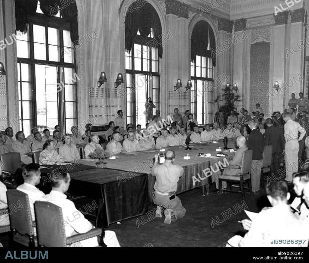 Japan Surrenders in the Government Building at Keijo (Seoul), Korea, 9 September 1945. The Japanese delegation is on the right side of the table. U.S. representatives, on the opposite side of the table.