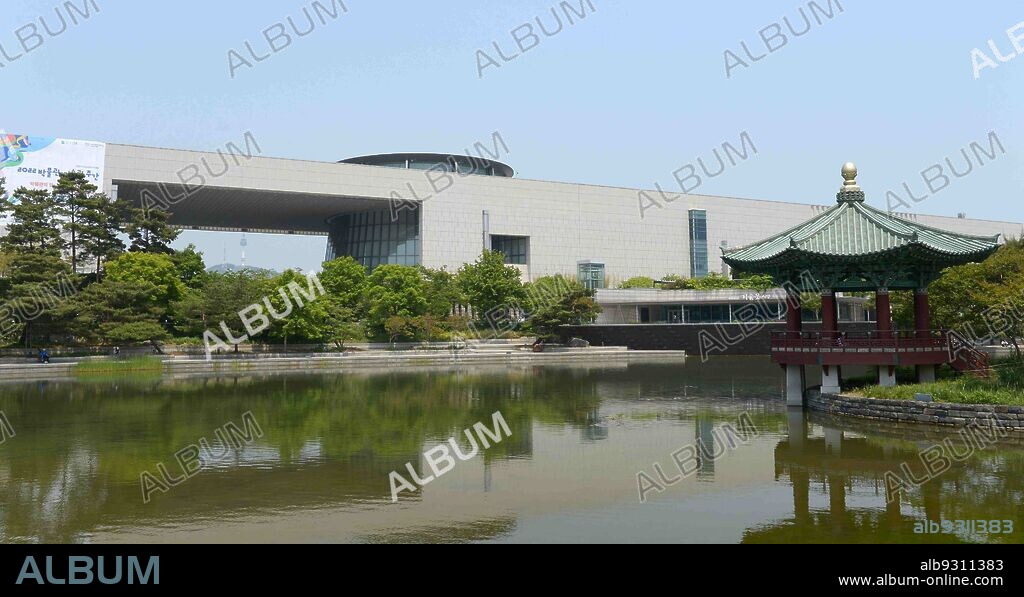National Museum of Korea: 'mirror pond' and 'Cheongjajeong' (small pavilion) in front of the museum, Seoul, South Korea.