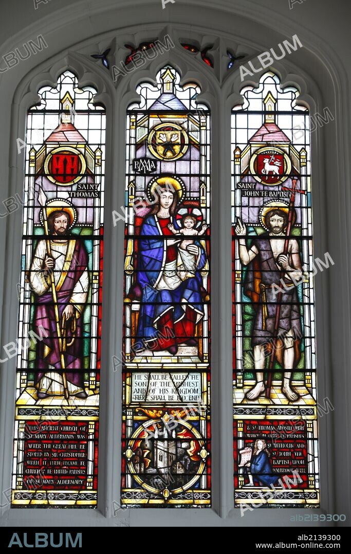 St Mary Aldermary church, City of London - South Chapel window by Lawrence Lee, Virgin Mary and Child flanked by St Thomas & St John the Baptist with, below, a roundel of the church tower and the kneeling figure of Christopher Wren.