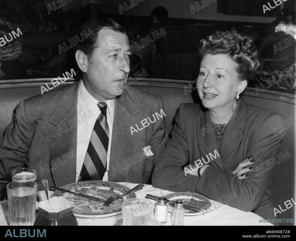 Chow Time For Screen Personalities: Actor Arthur Treacher, well known for his serving Ability as a screen butler, is shown here on the other side of the service at the Brown Derby Restaurant. He's Having lunch with Irene Ryan, a radio Actress.Arthur Treacher, tall, impeccable Englishman known to generations of filmgoers as the perfect butler, plans to go into the butler business.Treacher, 71, and now a TV personality, announced the formation of a franchise organisation that will use his name and image  to sell temporary butler, maid and household handyman services. February 16, 1947. (Photo by Wide World Photos).