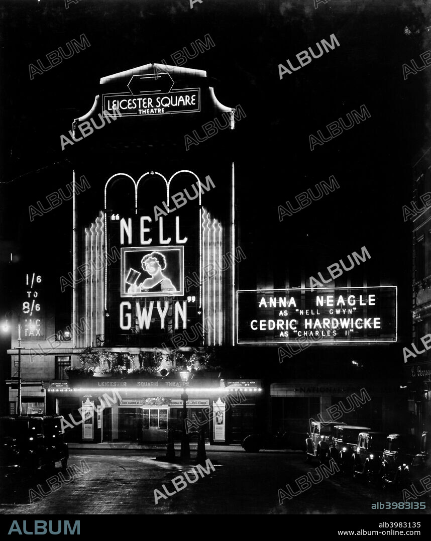 Night view of the Leicester Square theatre, London, c1930. Its Art Deco lines illuminated for 'Nell Gwyn', starring Anna Neagle and Cedric Hardwicke. Andrew Mather designed this theatre which was opened in 1930.