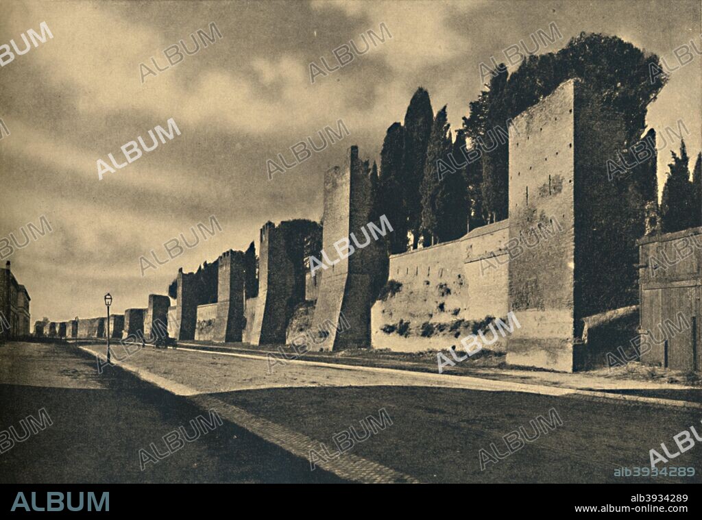 'Roma - The Aurelian Wall', 1910. Begun by Aurelianus in 271 and completed by his successor Probus in 275 , also known as the Wall of Imperial Rome,  was built when the menaces of Barbaric invasions became very pressing. The Aurelian Wallsare a line of city walls built between 271 AD and 275 AD in Rome, Italy, during the reign of the Roman Emperors Aurelian and Probus.  From Cento Vedute Classiche di Roma. [Enrico Verdesi, Rome, 1910].