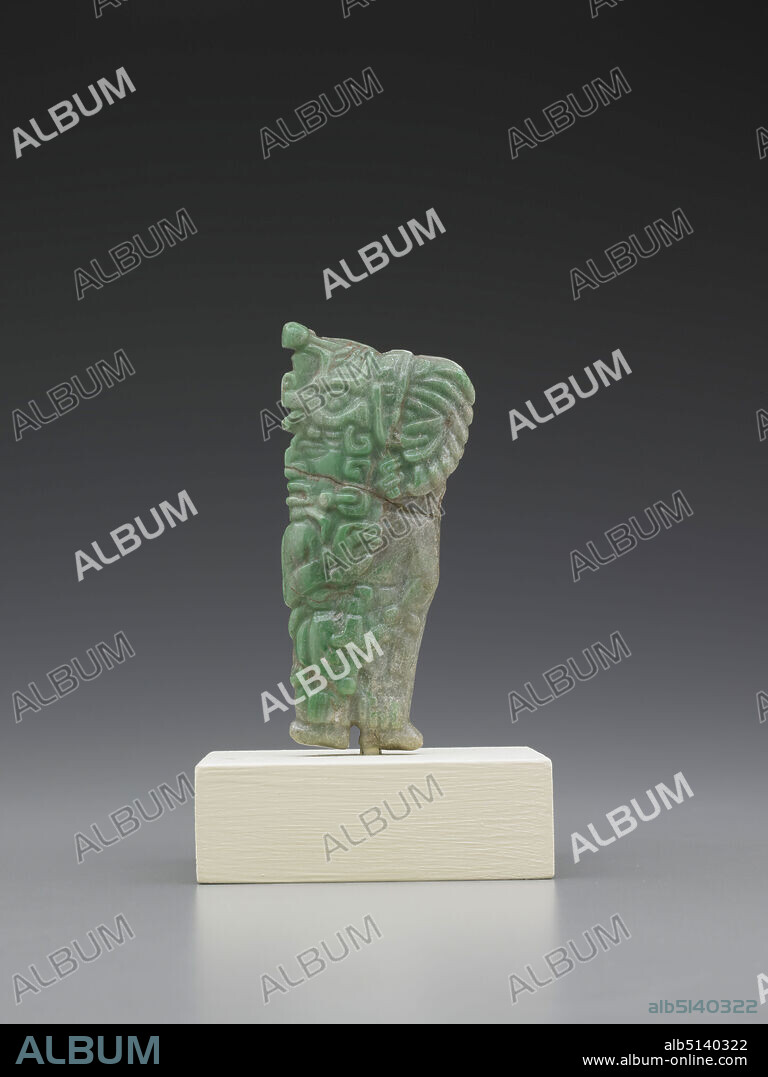 Pendant in the Shape of a Ruler or Lord, A..D. 200600, Jadeite, 9.98 × 4.17 × 1.73 cm (3 15/16 × 1 5/8 × 11/16 in.), This pendant in the shape of a standing male figure probably once belonged to a Maya noble. The craggy nose and specific details of the headdress may indicate that the pendant was intended to be a portrait of a particular individual, possibly the owner himself. The beaded tassel at the top of the headdress is that of the Jester God and is a common attribute of kings and nobles. The use of jade, the most highly prized material among the Maya, is also suggestive of the high status of its owner. The artist has worked this piece of jade, which is intermixed with a number of other minerals, so that the face and headdress would occupy the clearest green vein of the stone. , Made in Guatemalaor made in Mexico, Guatemala or Mexico, Maya, Early Classic Period, Jewelry.