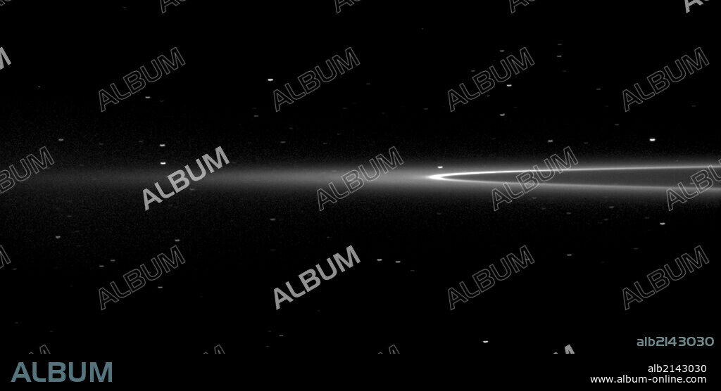 The Cassini spacecraft looks toward Saturn's tiny moon Aegaeon within the G-ring arc. (Photo by: Universal History Archive/UIG via Getty Images).