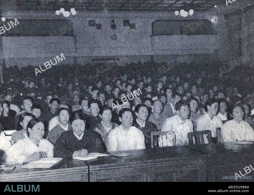 Propaganda photograph of communist party members in North Korea listening to a speech by leader Kim Il-sung as he first introduced the term Chollima in December 1956, shortly before the start of the 1957-61 five-year plan.