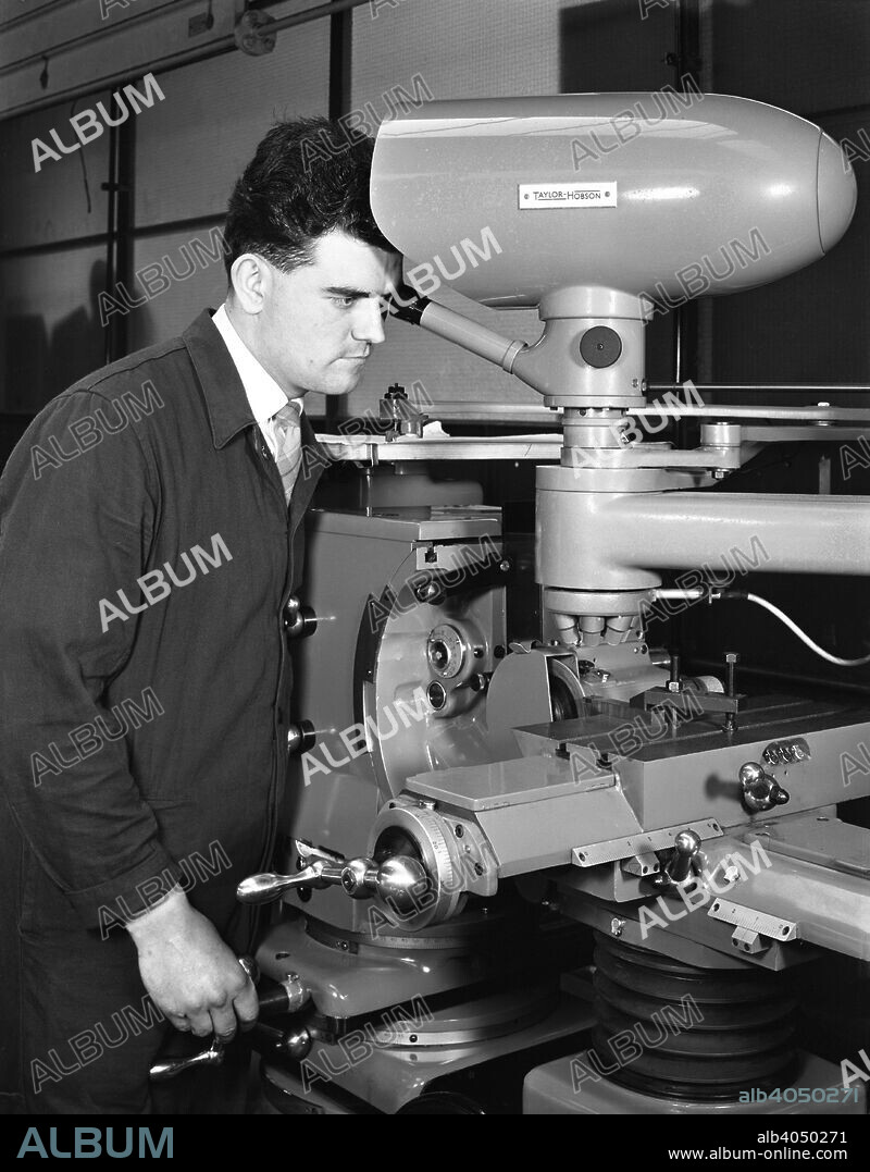 Worker using a cutting machine, Egdar Allen Steel Foundry, Sheffield, South Yorkshire, 1964. A technician at work on a Taylor Hobson optical profile cutting machine that was used for the precision cutting of metal. The photo electric tracer could follow template silhouettes or line drawings with very small line widths.