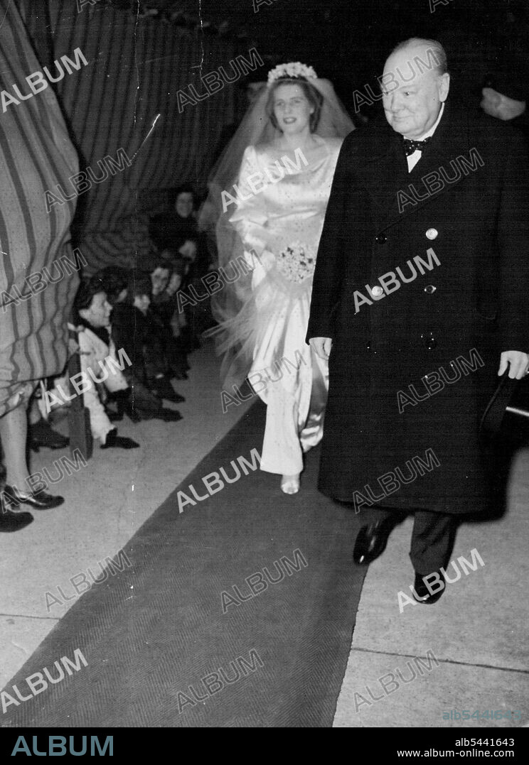 Winston Churchill's Daughter Weds -- Miss Mary Churchill, the bride, arrives at St. Margaret's, Westminster for her wedding this afternoon February 11, accompanied by her father, Mr. Winston Churchill. Note spectators peering beneath the canopy. February 11, 1947. (Photo by Associated Press Photo).