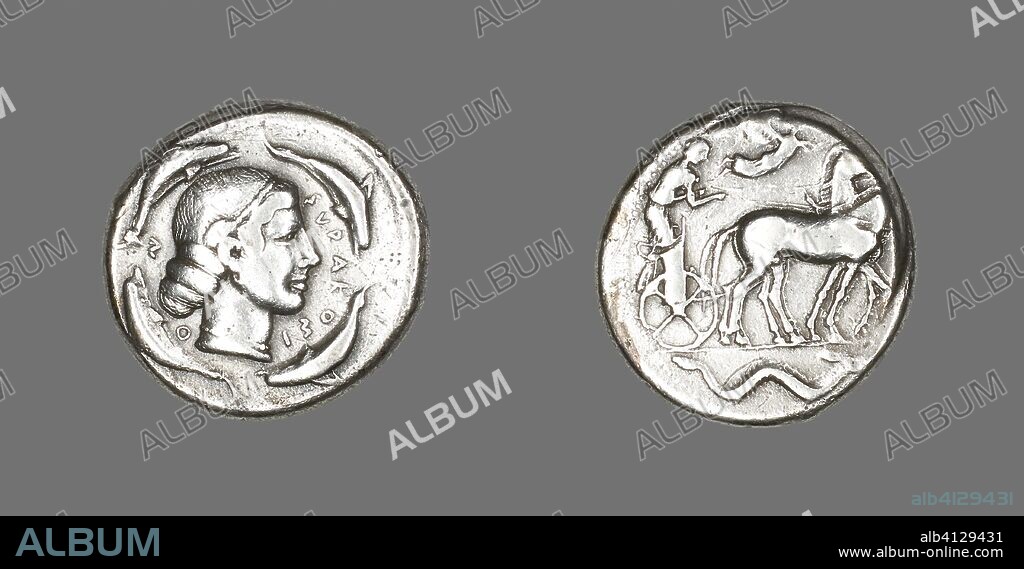ANCIENT GREEK. Tetradrachm (Coin) Depicting Arethusa. Greek, minted in Syracuse, Sicily. Date: 474 BC-450 BC. Dimensions: Diam. 2.6 cm; 16.95 g. Silver. Origin: Ancient Greece.