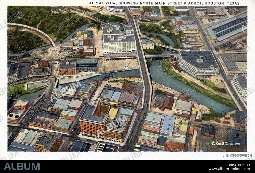 Aerial view of Houston, Texas, USA, 1930. Vintage postcard showing a bird's eye view of the North Main Street Viaduct. Many low and high rise buildings are visible.