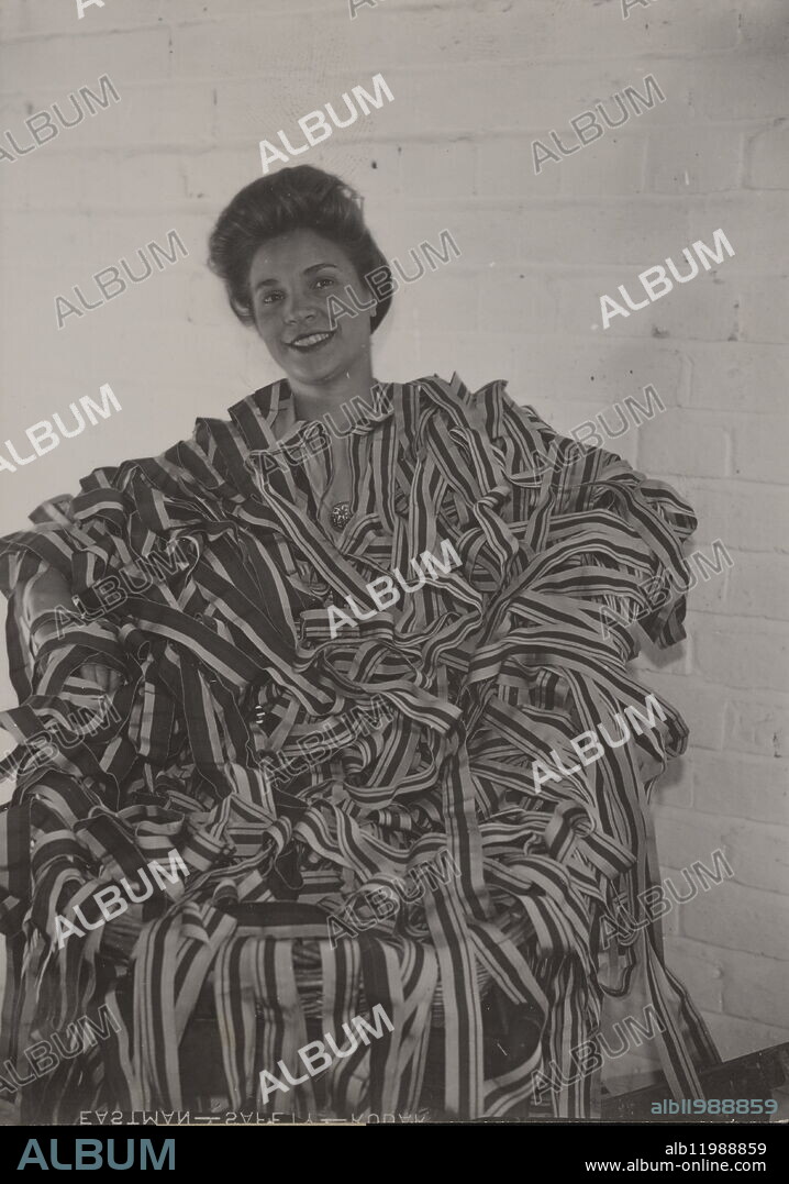Making 1939-43 Star and Africa Star Medal Ribbons, 24 August 1943 Making 1939-43 Star and Africa Star Medal Ribbons. One of the girls who helps to make the 1939-43 Star and Africa Star Medal Ribbons. 24 August 1943.