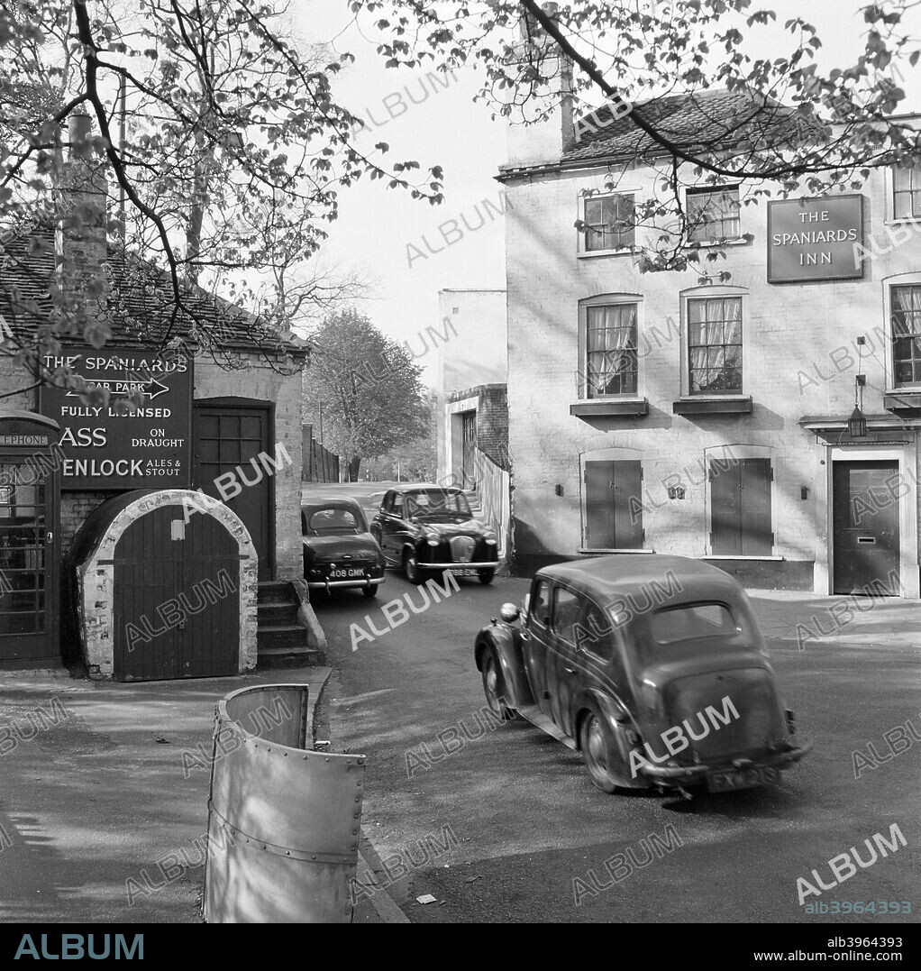 Spaniards Inn, Spaniards Road, Hampstead Heath, London, 1960-1965. Cars passing each other on the road between the Spaniards Inn and the old Toll House at the junction of Spaniards Road and Hampstead Lane.