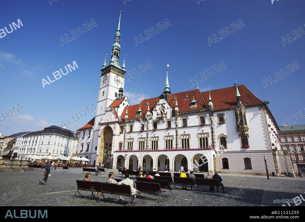 People relaxing in front of Town Hall in Upper Square (Horni Namesti), Olomouc, Moravia, Czech Republic, Europe.